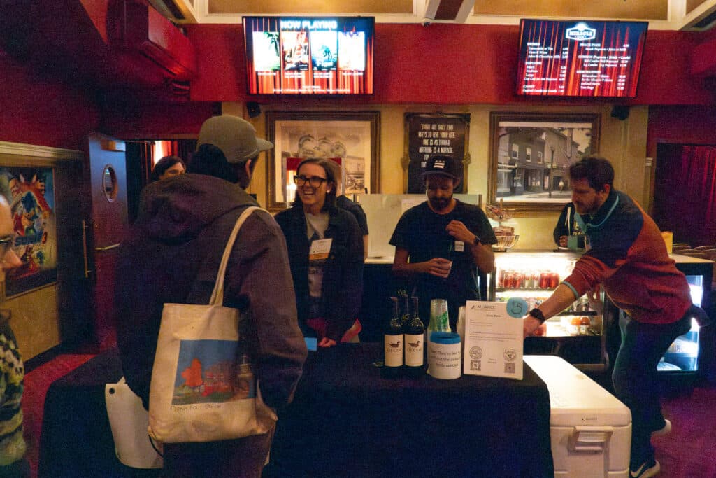 People talking in the lobby of the Miracle Theater during the 2025 WSFF in DC.