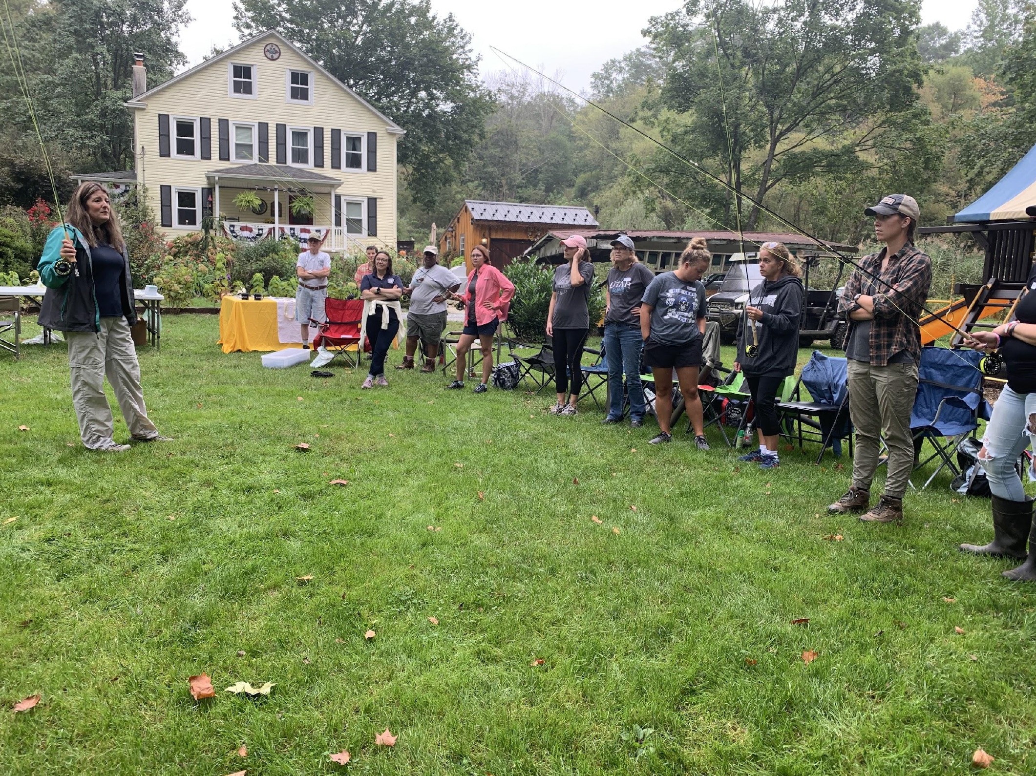 Finding Your Outside! Amidea Daniels, Youth &amp; Women's Coordinator and TIC Coordinator of the Pennsylvania Fish and Boat Commission, leads the group through the basics of setting up a fly rod.