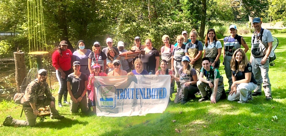A photo of the participants and instructors of Muddy Creek Trout Unlimited Women's Introduction to Fly Fishing Clinic.