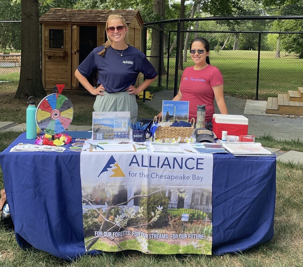 Alliance staff behind table display