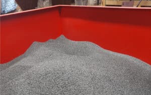 A large red bin full of seeds