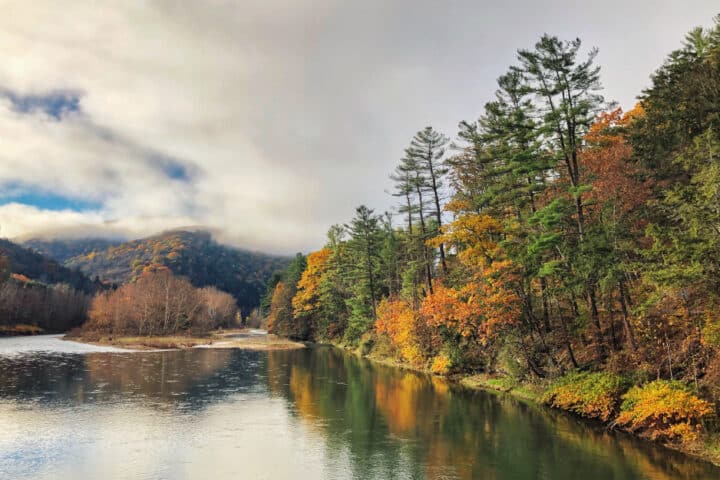 I river and riverbank with bright fall foliage