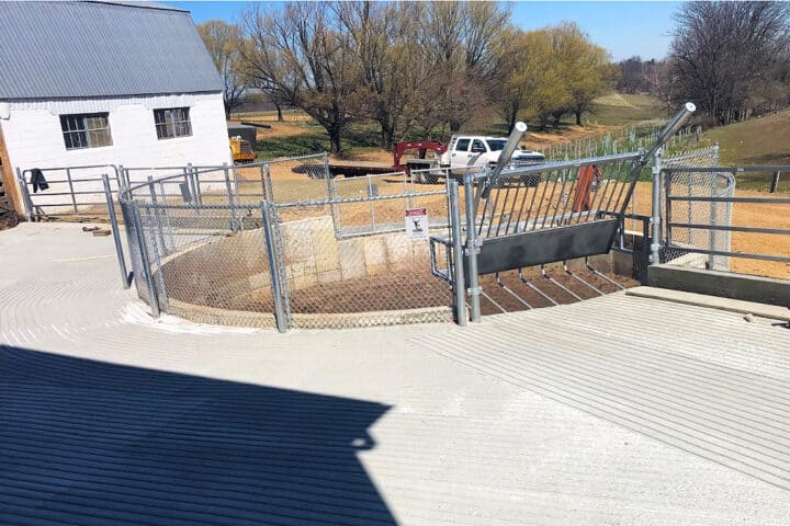 A large concrete container used for manure storage