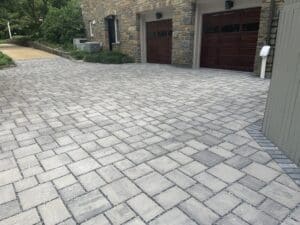 Gray permeable paver driveway outside of a DC home.