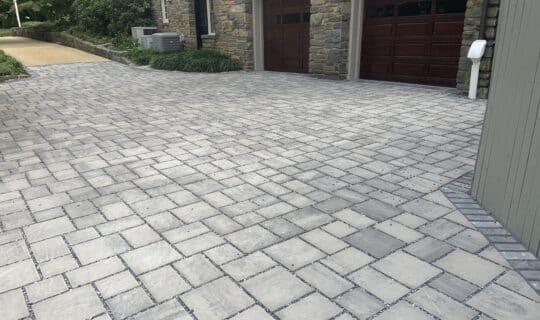 Gray permeable paver driveway outside of a DC home.