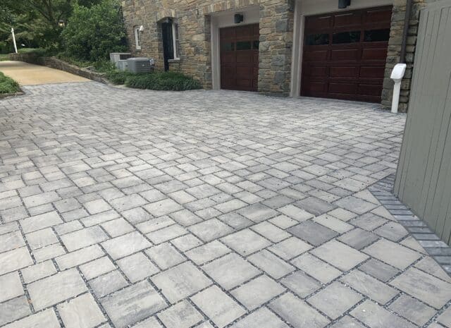 Gray permeable paver driveway outside of a DC home.