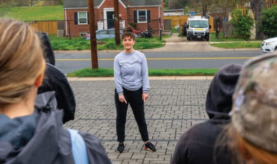 a person points at a permeable parking lot
