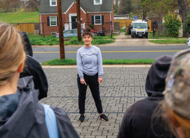 a person points at a permeable parking lot