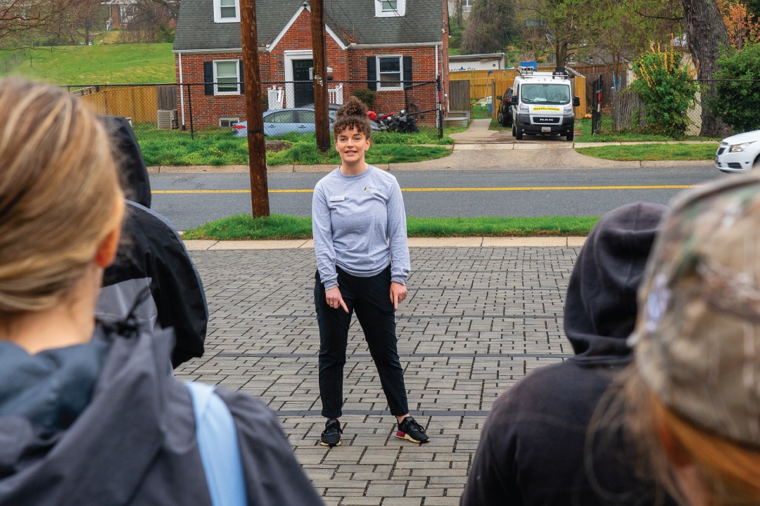 a person points at a permeable parking lot