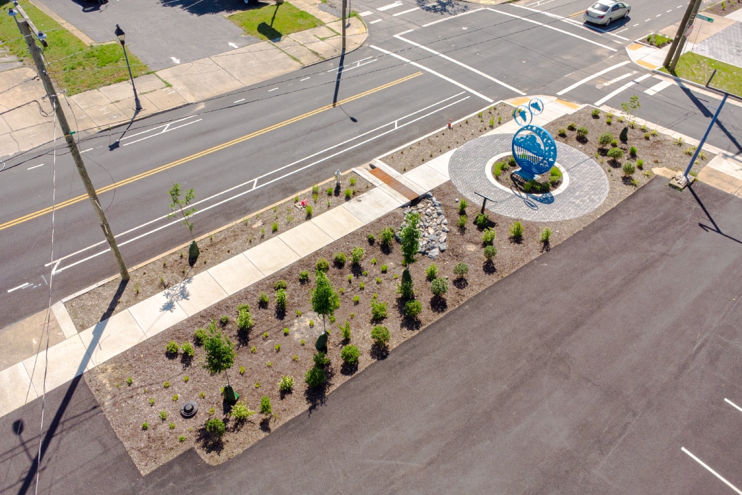 An overhead view of a blue metal sculpture in a garden