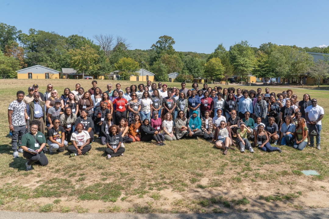 a large group of people posing for a picture
