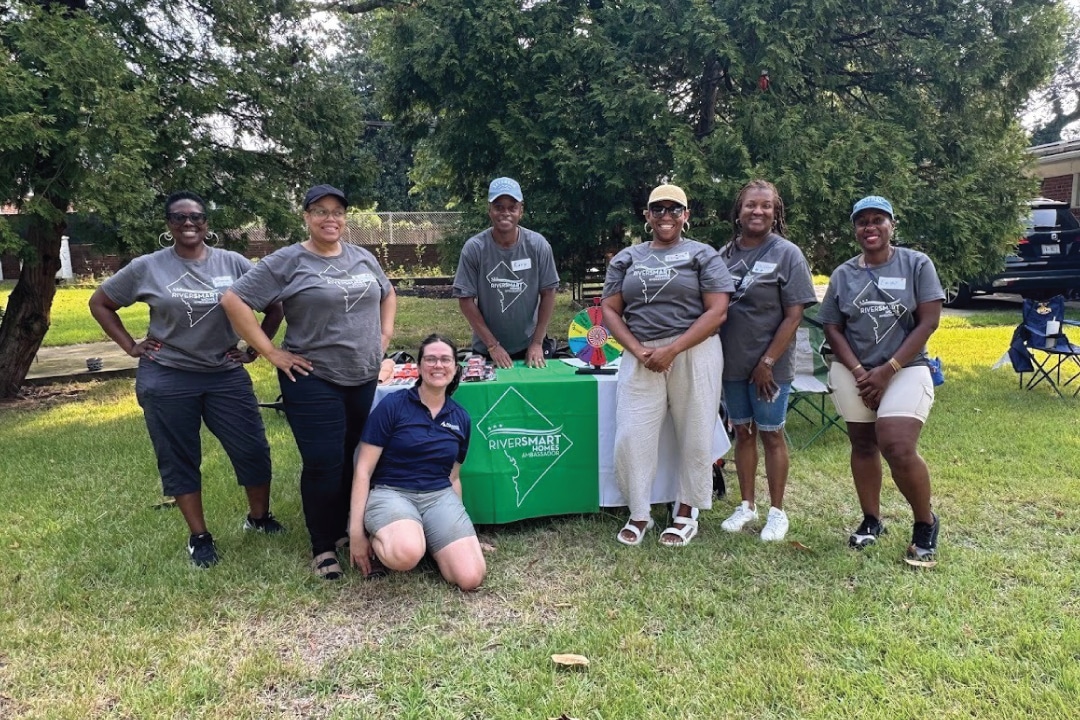 a large group of people smile for a photo
