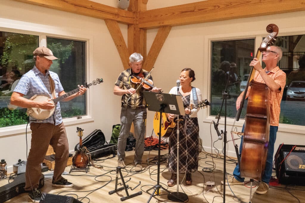 a band plays music on a small stage