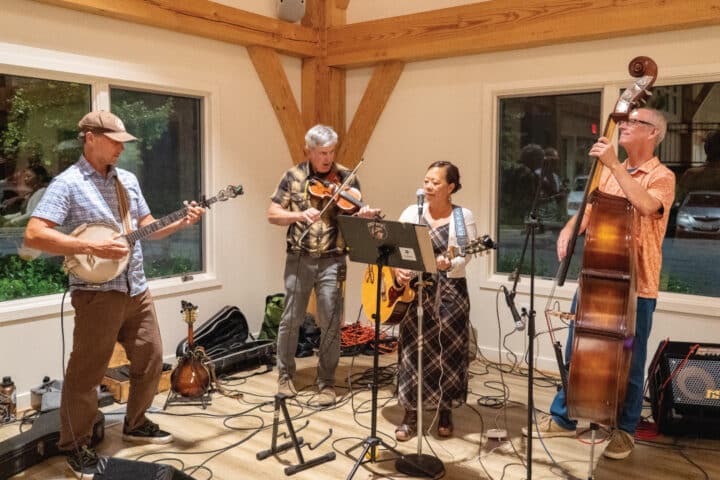 a band plays music on a small stage