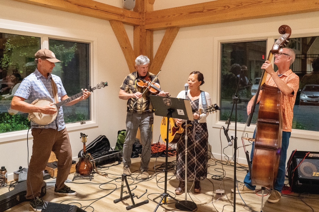 a band plays music on a small stage
