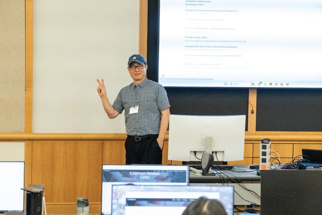 a person gives the peace sign while presenting