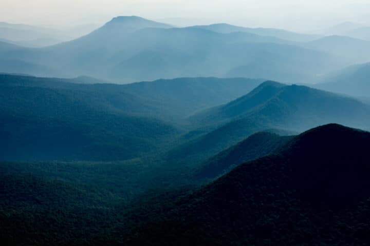 a landscape of forested mountains